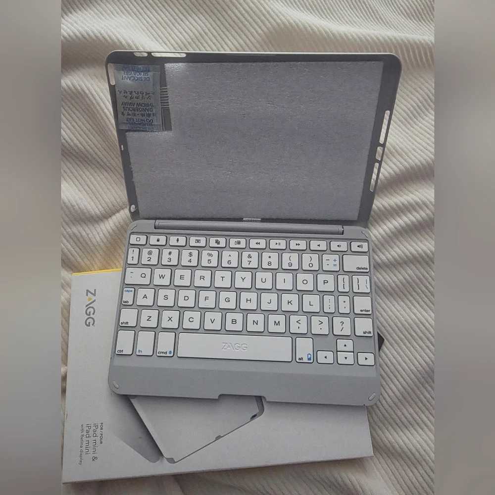ZAGG Folio hinged keyboard folio for ipad mini. New In Box